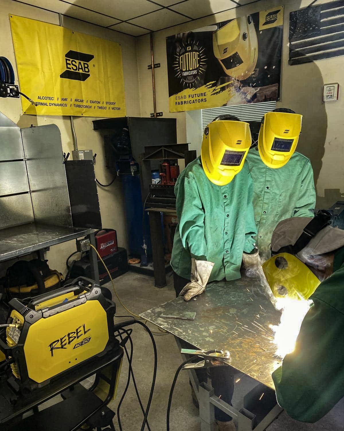Three people welding using the ESAB REBEL EMP206 | AC/DC